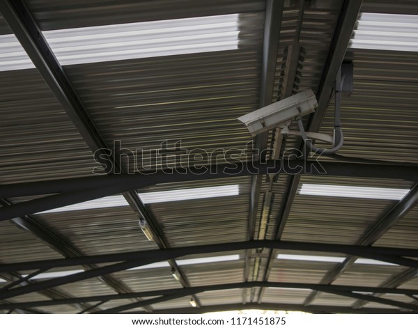 CCTV, security camera system\
operating at the parking lot in the mall protection\
security
