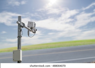 CCTV, security camera,average speed traffic camera on blurred highway road