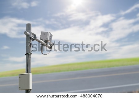 CCTV, security camera,average speed traffic camera on blurred highway road
