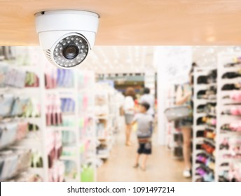 CCTV System Security Inside Of Stationery Store.Surveillance Camera Installed On Ceiling To Monitor For Protection Customer In Grocery Shop