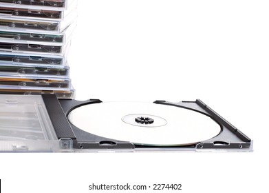 CD box open ahead of cds stack over a white background