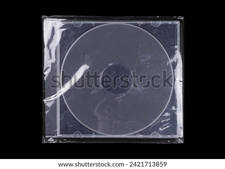CD case on black background. Isolated transparent disk mockup. Clean cover box template.
