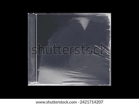 CD case on black background. Isolated transparent disk mockup. Clean cover box template.