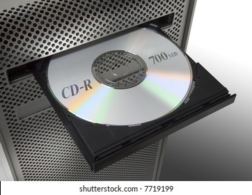 A CD in the CD-player of a computer.