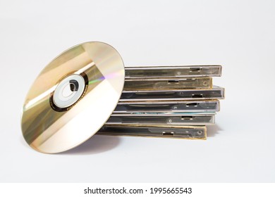 The CD (Compact Disk) and the stack of CD's cover on a white background.