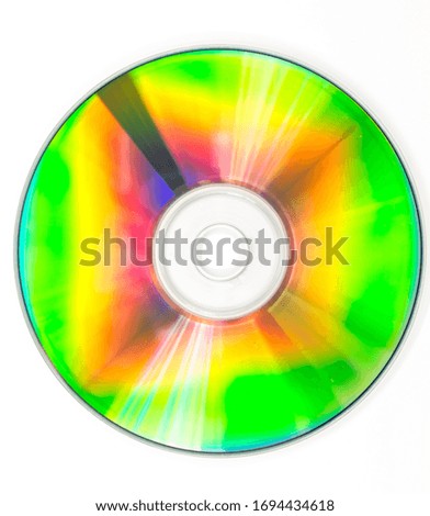 CD DVD compact optical disk storage medium with dust and scratches. Rainbow spectrum of iridescent colors