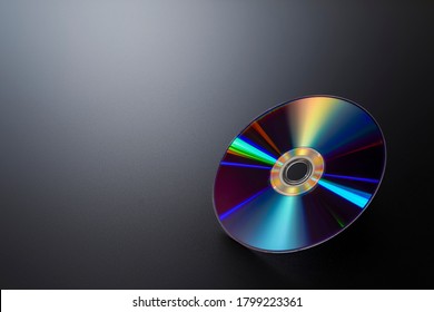 CD & DVD disk on black background