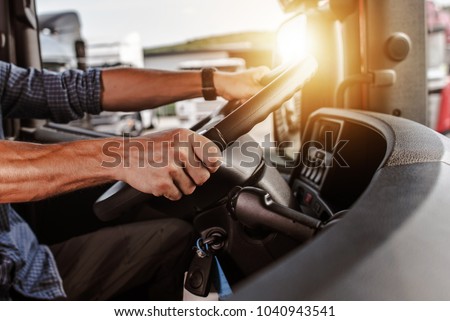 CDL Commercial Driver Inside of His Truck. Transportation Industry Theme.