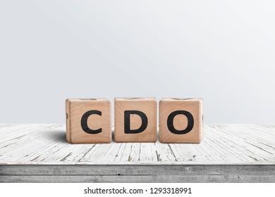 CDO Sign Collateralised Debt Obligations On A Wooden Desk In A Bright Room