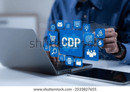 CDP, Customer Data Platform concept. Businessman working on laptop and pointing CDP icons. Data planning for customer database mangement and accessible to other systems. Online Marketing.
