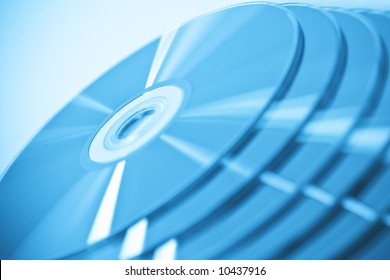 CDs in stack. Useful as a background. Very narrow focus