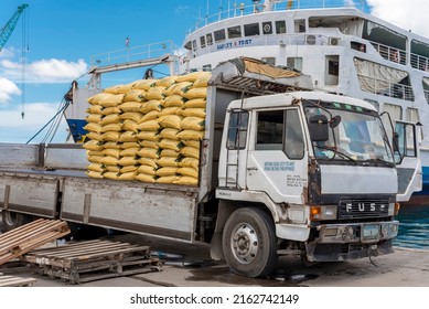 Cebu City, Philippines - May 2022: An Open Bed Cargo Truck Laden With Sacks Of Hog Grower Pellets, Ready To Be Loaded Unto A RORO Vessel. At The Port Of Cebu.