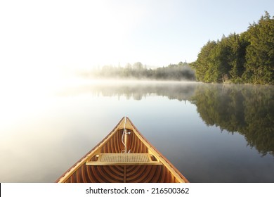 Cedar Canoe Bow on a Misty Lake - Ontario, Canada - Powered by Shutterstock