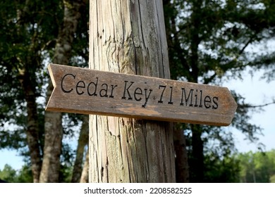 Cedar Key 71 Miles Wood Sign On A Light Pole In The Country