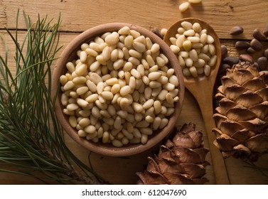 Cedar nuts and cones on wooden table