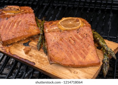 Cedar Plank Salmon With Lemon Cooking On Grill