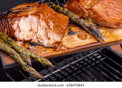 Cedar Plank Salmon With Lemon Cooking On Grill