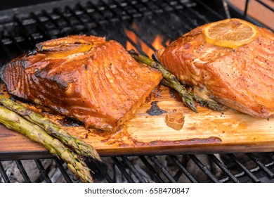 Cedar Plank Salmon With Lemon Cooking On Grill