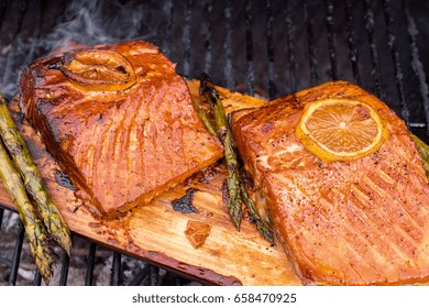 Cedar Plank Salmon With Lemon Cooking On Grill