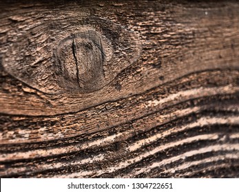 Cedar wood plank texture taken from the side of a Southern American ranch style home in the summer. Ceder Wood Texture photo of knot in the cedar plank. Wooden Texture Background