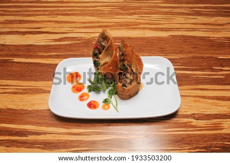 Cedisious disk known as philly cheese steak egg rolls
