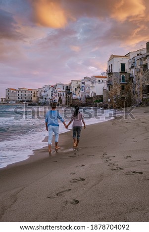 Cefalu, the medieval village of Sicily island, Province of Palermo, Italy. Europe, a couple on vacation at the Italian Island Sicilia