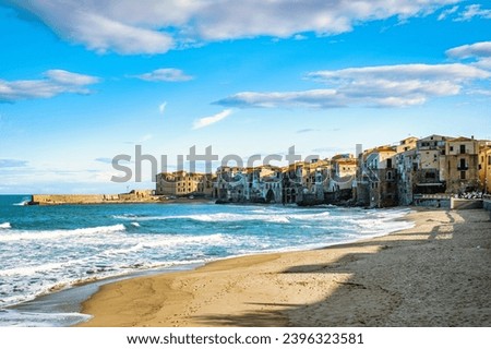 Cefalu, the medieval village of Sicily island Province of Palermo, Italy Europe, beach of Cefalu in November during stormy weather on a sunny day