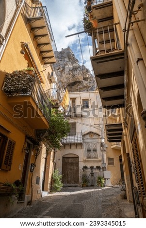Cefalu in Sicily with its narrow mediterranean streets and balconies