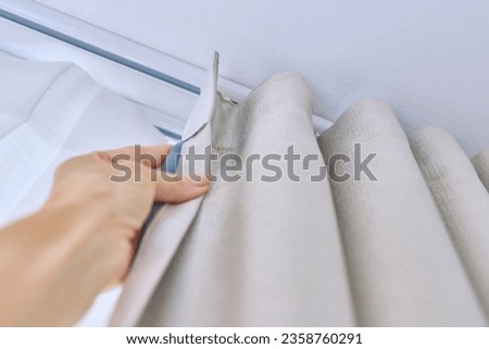 Ceiling cornice in two rows with curtains close-up