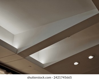  ceiling of the corridor in the plasterboard soffit is equipped with light halogens illuminating the ramp on the stage or in the shop. the goods look better if there are strong lamps in the ceiling