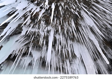 Ceiling of Dangerous Icicles Inside Ice Cave at Frozen Lake Baikal in Siberia, Russia
