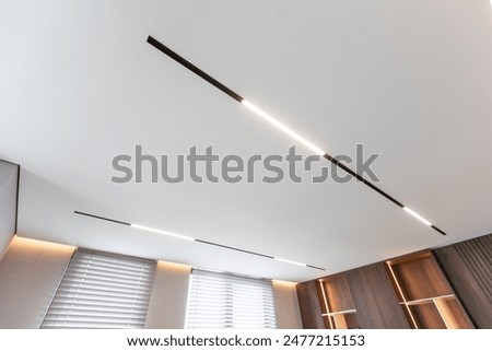 The ceiling is decorated by light