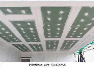 Ceiling Gypsum Board Installation At Construction Site