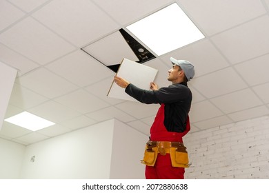 Ceiling installation with expert technicians In the room that is in the construction process. - Shutterstock ID 2072880638