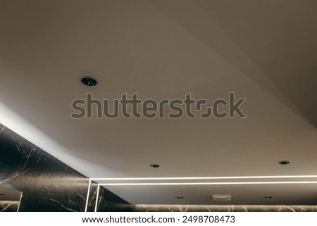 Ceiling with lighting in the bathroom