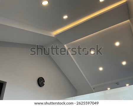 ceiling lighting and black clock design