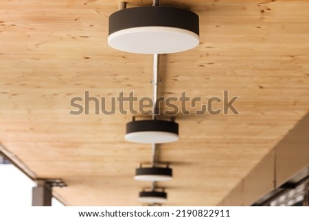 Ceiling Lights LED Round Surface. Spot Lamps on wooden Ceiling outdoor. Lamps on Ceiling in Terrace or Balcony Outdoor.