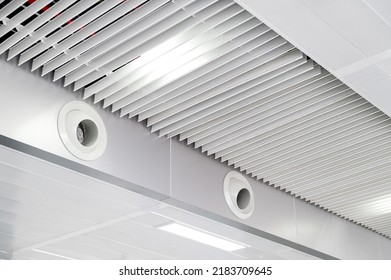 Ceiling Mounted Cassette Type Air Conditioner And Modern Lamp Light On White Ceiling. Duct Air Conditioner For Home Or Office