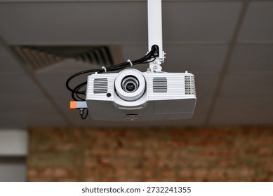 Ceiling Mounted Digital Projector in Modern Office or Conference Room