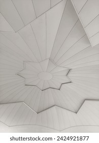 The ceiling is in the shape of a white star