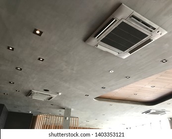 Ceiling type 4 directions air vent system air conditioner unit in a modern office building and coffeeshop