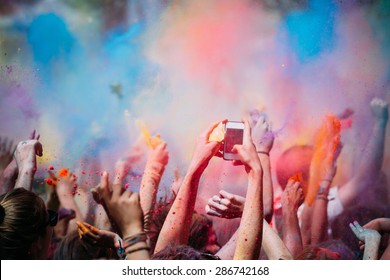 Celebrants dancing during the color Holi Festival