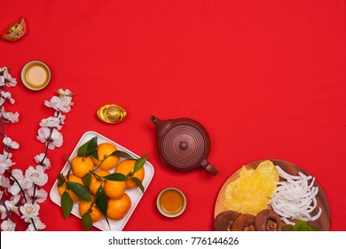 Celebrate Chinese New Year Background With Orange Fruit For Warship, Red Envelope And Beautiful Blossom.