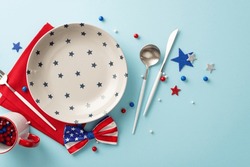 Celebrate Independence Day With Festive Table Arrangement. You'll Find Top View Patriotic Items Like Plate, Cup, Cutlery, Napkin, Sprinkles, Stars, Bow-tie, Light Blue Surface. Perfect For Promotions