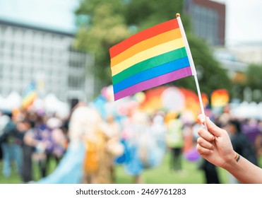 Celebrate in pride month festival. Pride movement transgender hand holding LGBTQ rainbow flag for freedom. Gatherings of friends in parade communities celebrating LGBTQ+ causes. - Powered by Shutterstock