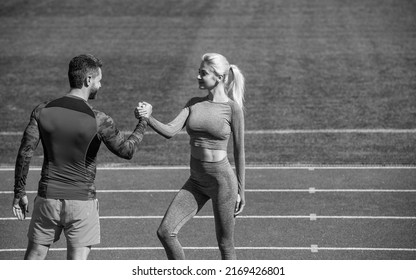 celebrate team win with gesture of shake hand. after exercising or compete in armwrestling