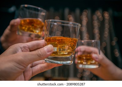 Celebrate whiskey on a friendly party in  restaurant - Shutterstock ID 2089805287