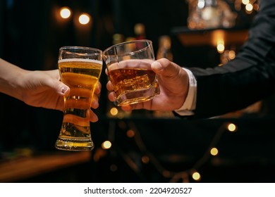 Celebrate whiskey on a friendly party in  restaurant - Powered by Shutterstock