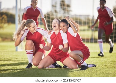 Celebrate, winning and success female football players with fist pump and hurray expression. Soccer team, girls or friends on a field cheering with victory sign, celebrating win in a sports match - Powered by Shutterstock