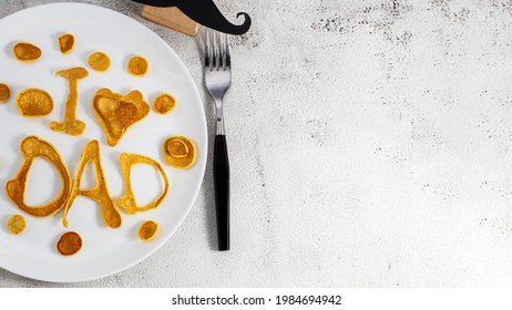 Celebrating Father's Day. Breakfast: Pancakes In Form Of Congratulations - I Love Dad , And Coffee Mug And Copy Space.